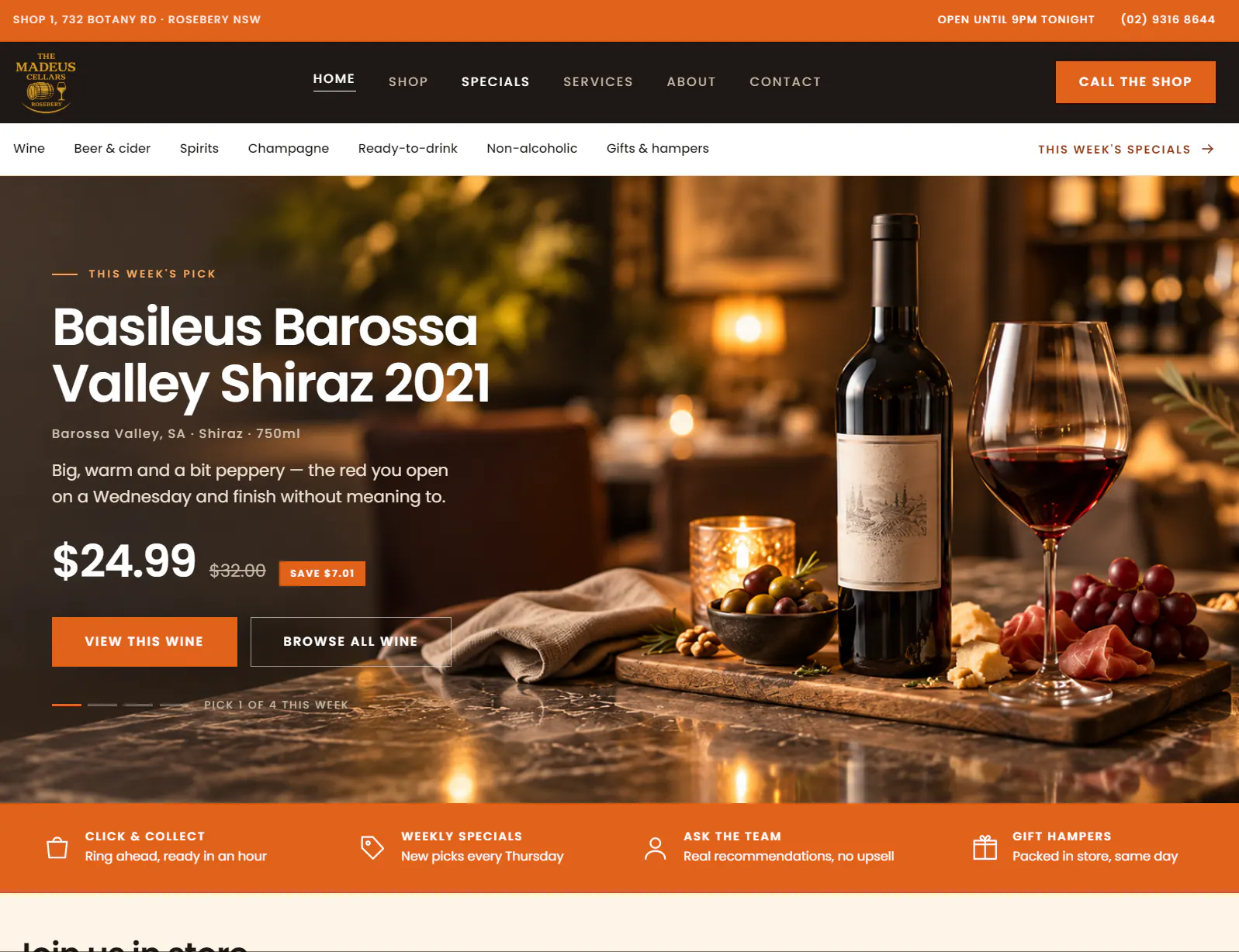 The Madeus Cellars home page: a wine shop header with opening hours and phone number, shopping categories, and a featured Barossa Valley Shiraz with its price, over a photograph of the bottle and a glass of red.